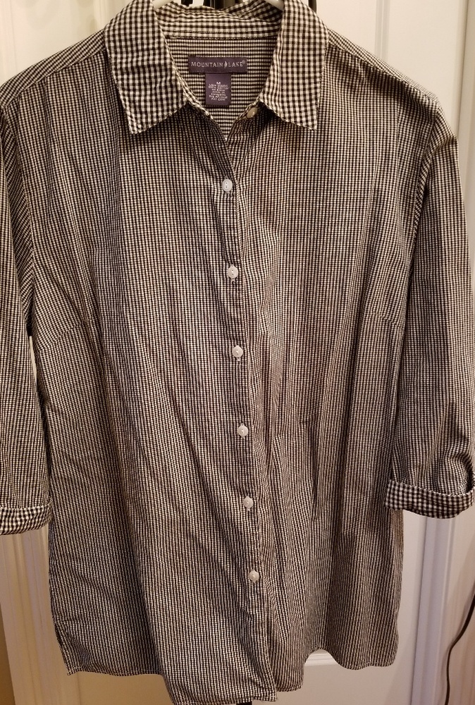 Lady's 3/4 sleeve, button down shirt.